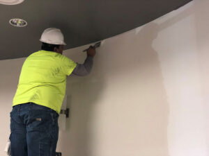 PAINTech worker interior painting Four Ideas to Update the Interior Paint of Your Commercial Building