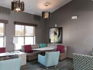 Lounge with new window treatments Custom Window Treatments Can Lower Your Business's Utility Costs