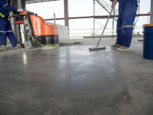 Contractors completing concrete polishing Why Working with an Experienced Polished Concrete Floor Contractor  Ensures Your Team's Safety
