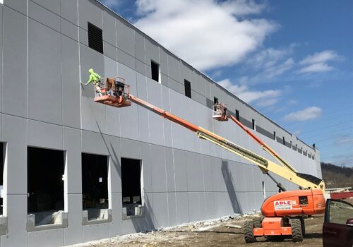 PAINTech contractors painting the exterior of an office