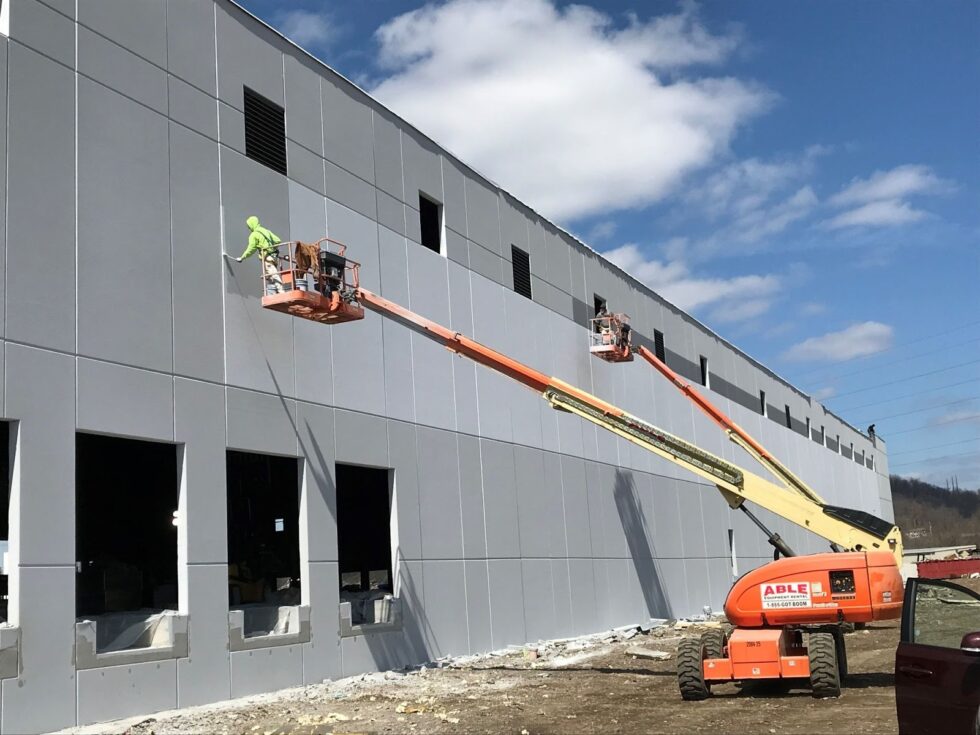PAINTech contractors painting the exterior of an office