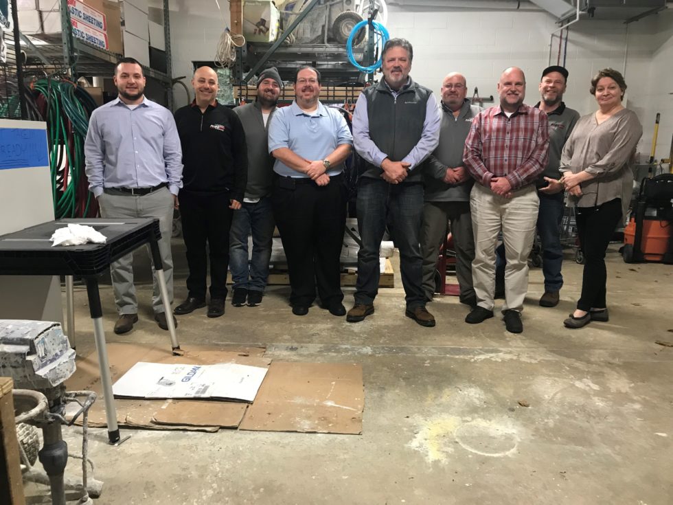 Group of PAINTech employees smiling for the Movember Foundation