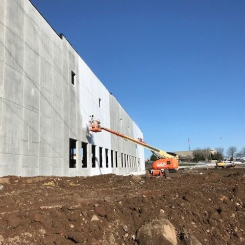 PAINTech working on an industrial painting project outside
